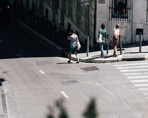 Person walking comfortably on a sidewalk